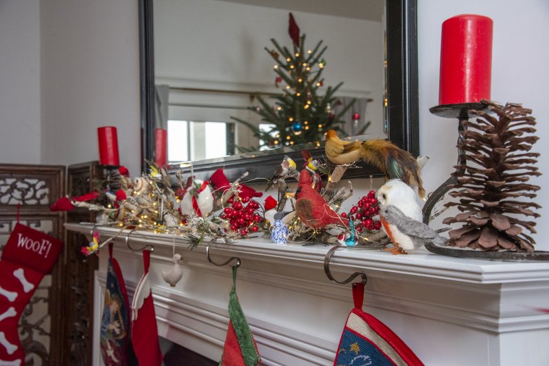 Tri and Brian McCarthy’s mantel boasts a group of felt-tufted birds.